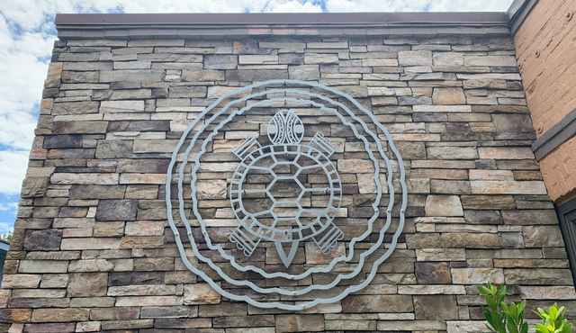 Image of metal turtle clan decor on museum exterior