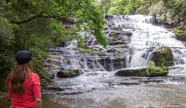 photo of people viewing a waterfall