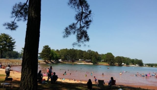 image of people playing in the beach on Lake Keowee