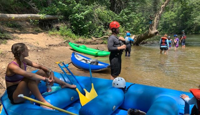 photos of rafts beached to do rope swing into chattooga river