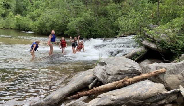 photo of girls swimming at the lagoon at Woodall Shoals