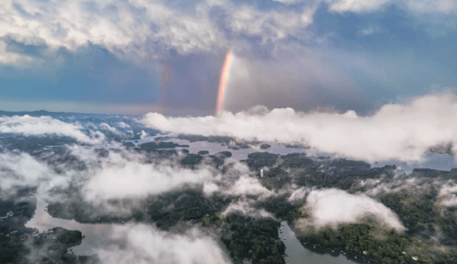 image from a drone of rainbow overlooking the lake