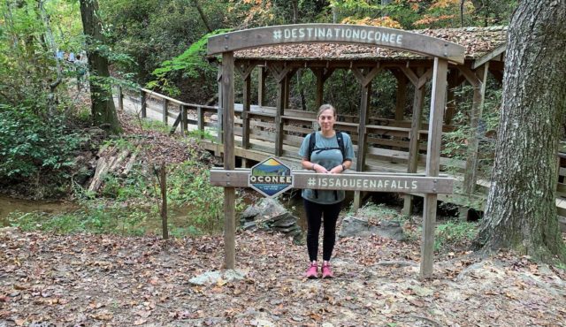 photo of blog author Chanda Morrison by #Destination Oconee sign