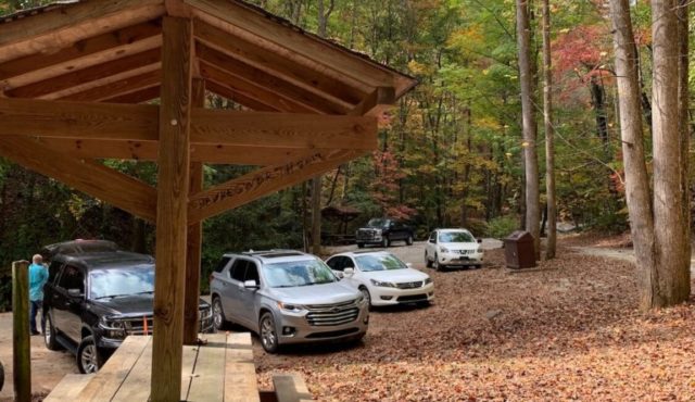 photo of covered picnic table near parking area