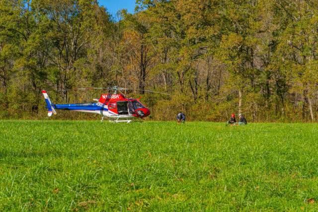 photo of helicopter prepping to release trout