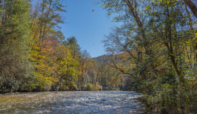 photo of helicopter over river on trout release day