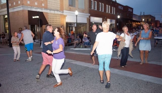 photo of people dancing during jazz on the alley