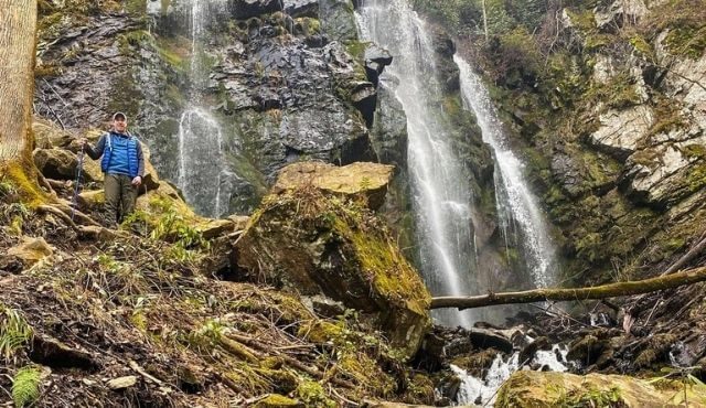 photo of hiker near Lee Falls