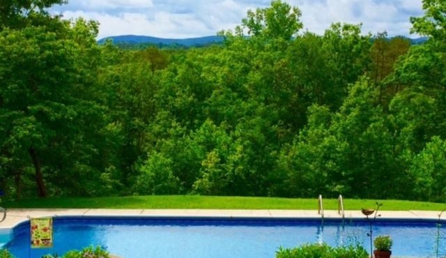 photo of view of pool and mountains in background