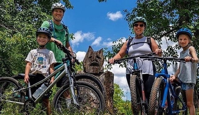 photo of family with mountain bikes