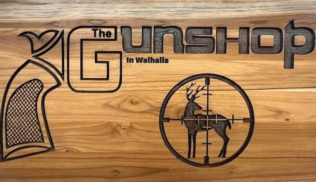 wooden logo for The Gun Shop in Walhalla