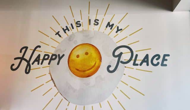 photo of mural inside Eggs Up Grill
